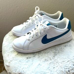 Women’s turquoise and white Nike sneakers